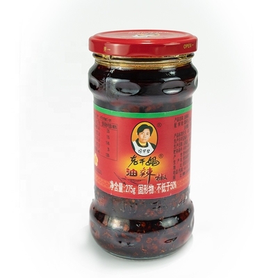 Salsa de chile Laoganma mezclada con aceite rojo de chile con sabor a pollo fermentado y soja